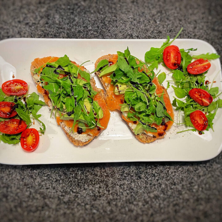 Smoked Salmon & Avocado on Sourdough Bread served with a Rocket Salad